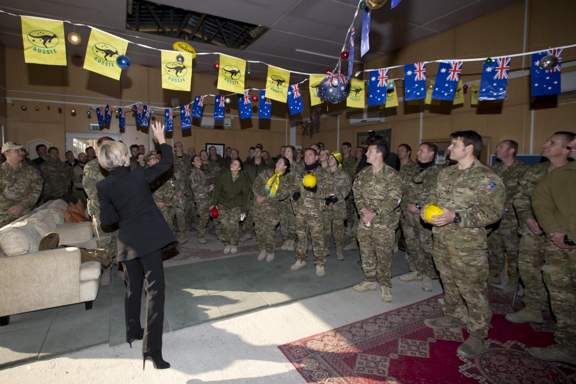 Members of Joint Task Force 636  received footballs donated by the West Coast Eagles and Fremantle Dockers, 26 January 2015