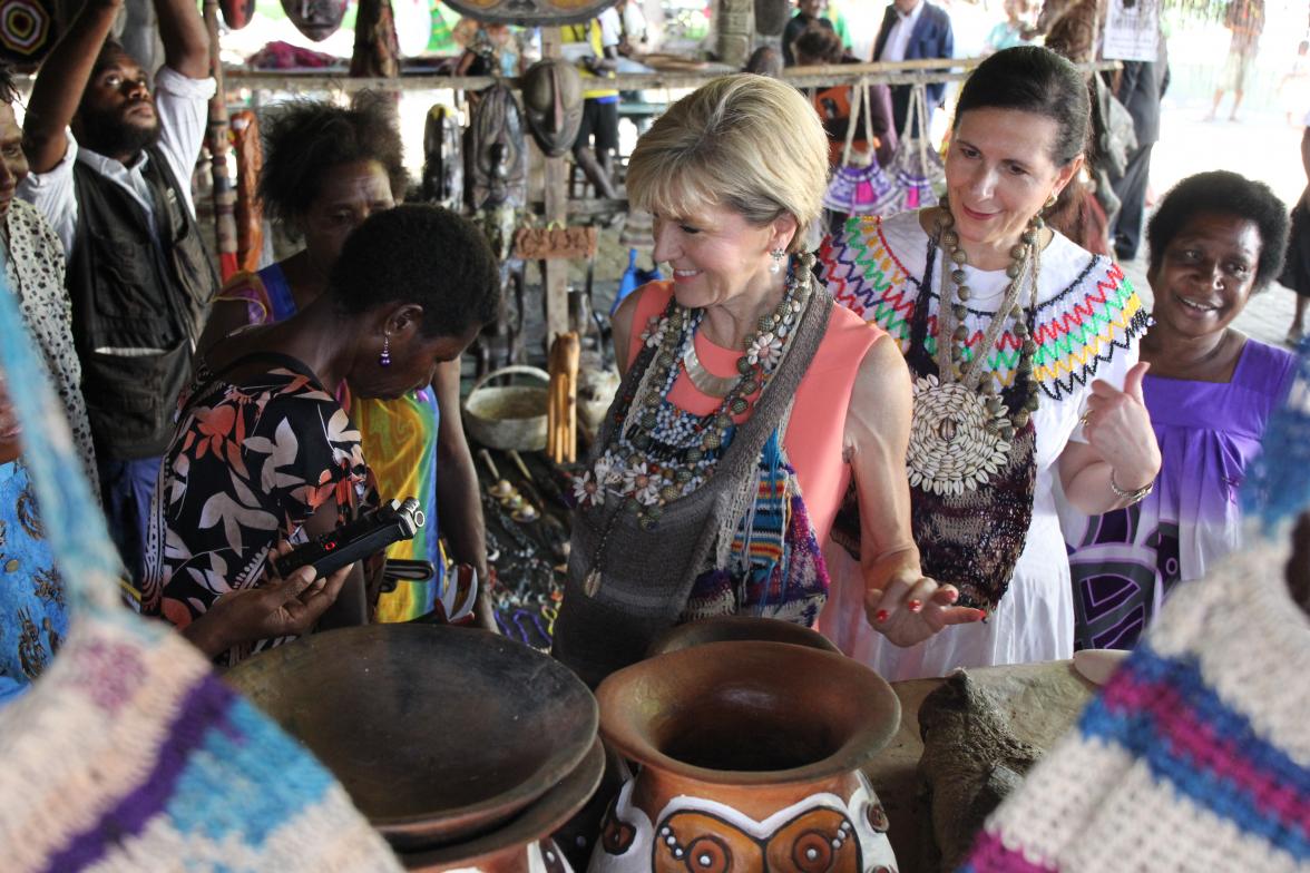 Minister for Foreign Affairs, Julie Bishop and Senator the Hon Concetta Fierravanti-Wells learning about local crafts from women at a market in Madang. Photo credit: DFAT/Aaron English