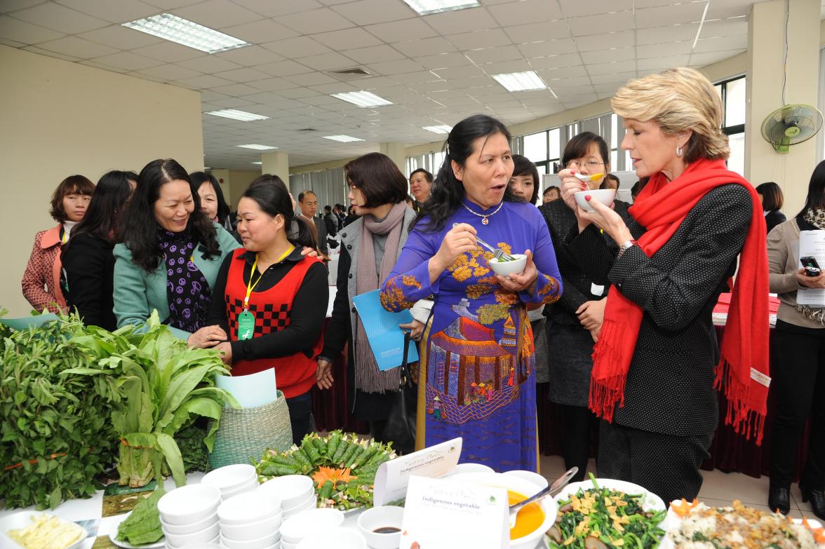 Australian Foreign Minister Julie Bishop and President of Vietnam Women’s Union Nguyen Thanh Hoa trying some vegetable dishes from an Australian funded project to improve the profitability and sustainability of smallholder vegetable farmers in the highlan