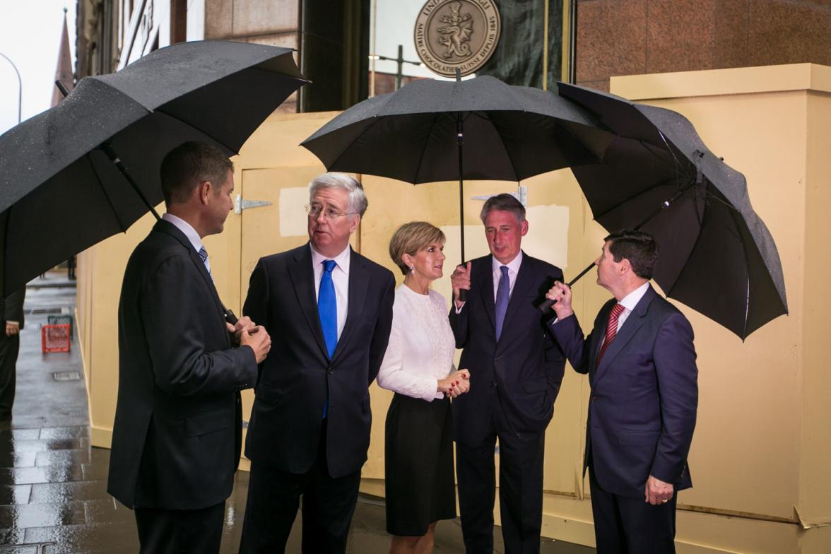 NSW Premier Mike Baird, UK Defence Secretary Michael Fallon, Foreign Minister Julie Bishop, UK Foreign Secretary Philip Hammond, Defence Minister Kevin Andrews take a moment to reflect at the site of the Sydney Siege - the Lindt Cafe. 2 February 2015.