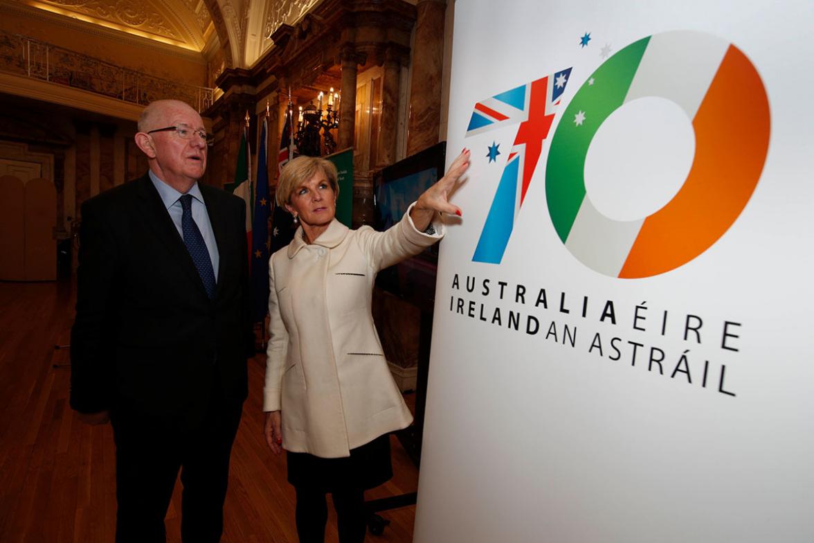 Foreign Minister Julie Bishop and Irish Minister for Foreign Affairs and Trade Charlie Flanagan view a logo marking the 70th anniversary of diplomatic relations between their two countries. Photo credit: Commonwealth of Australia