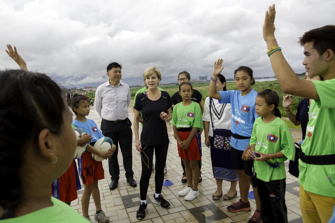 Foreign Minister Julie Bishop with young Lao Rugby players from the Australian aid-funded ‘Pass it Back’ sports development program. Vientiane, Laos. 26 July 2016. Photo credit: DFAT/Bart Verweij