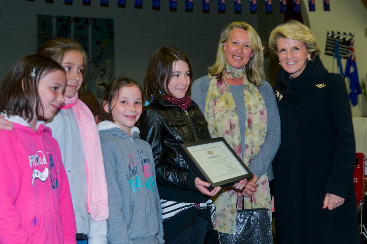 Foreign Minister Julie Bishop and Naomi Stokes - the great granddaughter of Sergeant Charles Albert Stokes DCM - presents the 2014 Sadlier-Stokes Prize during ANZAC Day commemorations in the French town of Villers-Bretonneux in the Somme.