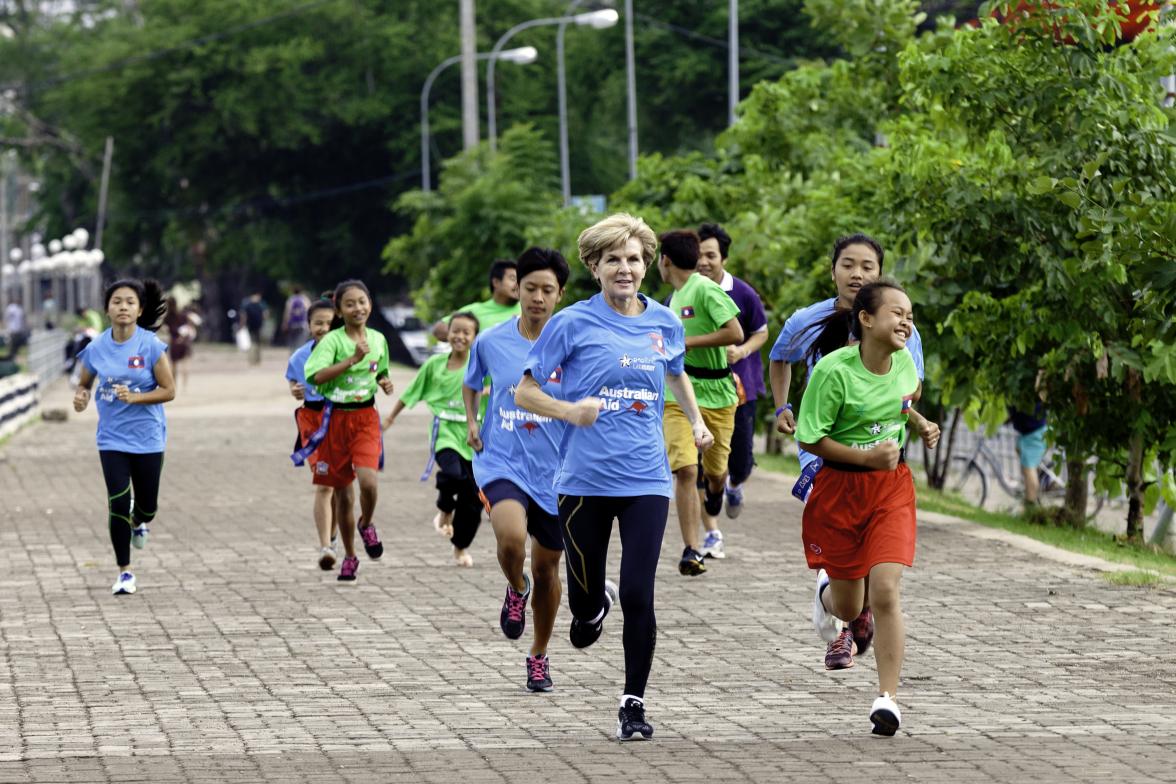 Australian Foreign Minister Julie Bishop goes for a morning run with young Lao Rugby players and coaches from the Australian aid-funded ‘Pass it Back’ sports development program. Vientiane, Laos. 26 July 2016. Photo credit: DFAT/ Bart Verweij