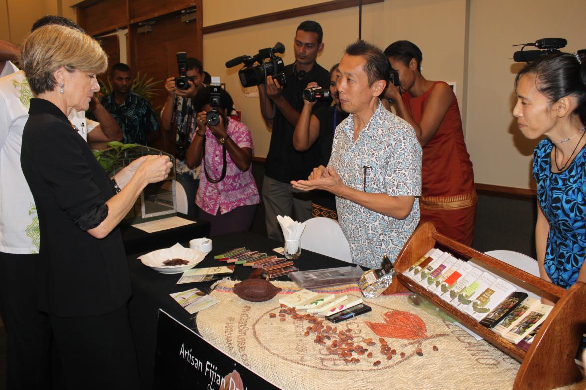 Foreign Minister Julie Bishop samples Adi Chocolates produced under Australia's Market Development Facility, Suva. 1 November 2014.