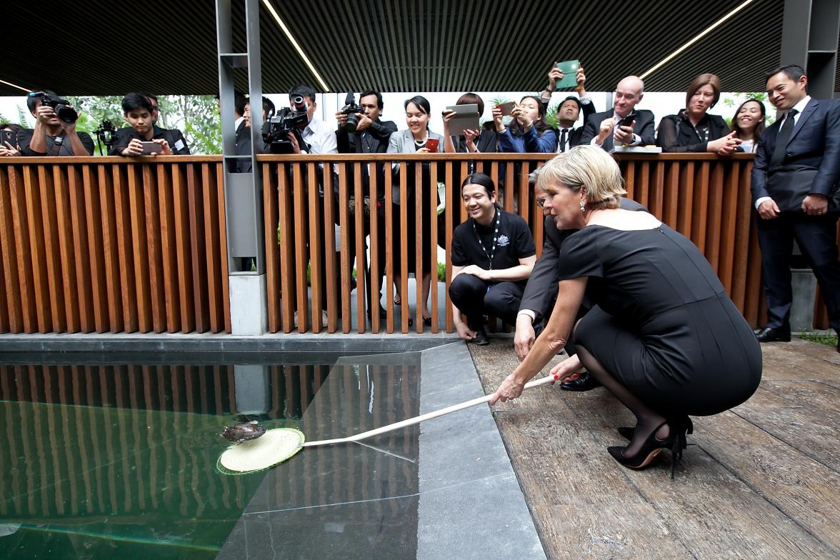 Foreign Minister Julie Bishop along with Thai Foreign Minister, His Excellency Mr Don Pramudwinai, releases a turtle from a pool at the former embassy into a pool at the new Australian Embassy Bangkok. Thailand, Bangkok, 3 August 2017.