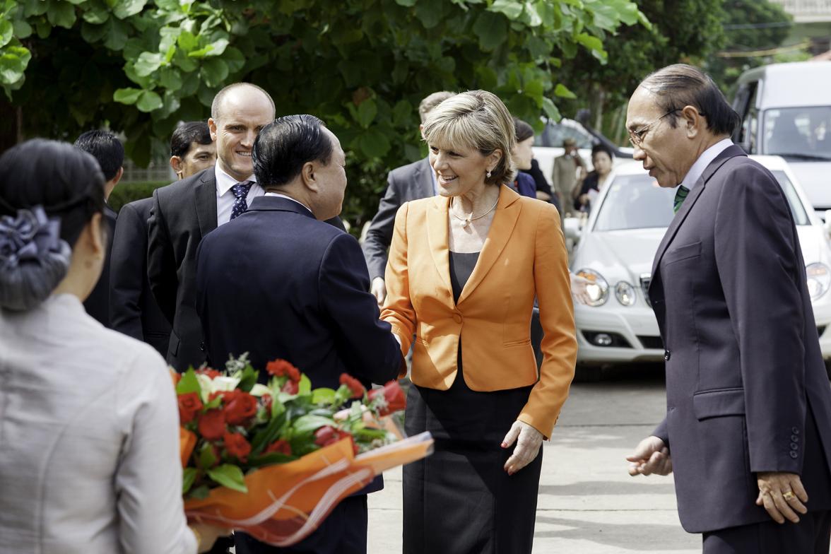 Foreign Minister Julie Bishop is greeted by H.E. Associate Professor Som Ock Kingsada,  Vice-Minister of Public Health at the UXO Visitor Centre of the Cooperative Orthotic and Prosthetic Enterprise (COPE). Photo: Bart Verweij