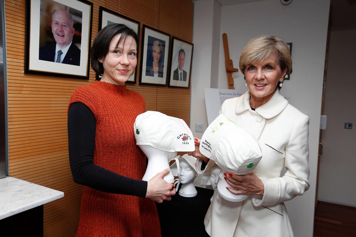 Foreign Minister Julie Bishop learns about the ‘Roses from the Heart’ project from Erin Lee. The project by Australian artist Christina Henri uses bonnets to honour the memory of thousands of Irish women who were transported to Australia. Photo credit: Co