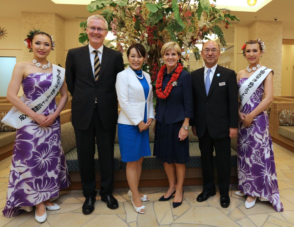 Minister for Foreign Affairs Julie Bishop is welcomed on arrival at the Pacific Island Leaders Meeting (PALM7 Summit) in Iwaki Japan by Hawaiian-style hula dancers, the local member for Iwaki and former Japanese Minister for Women, Masako Mori, and Austra