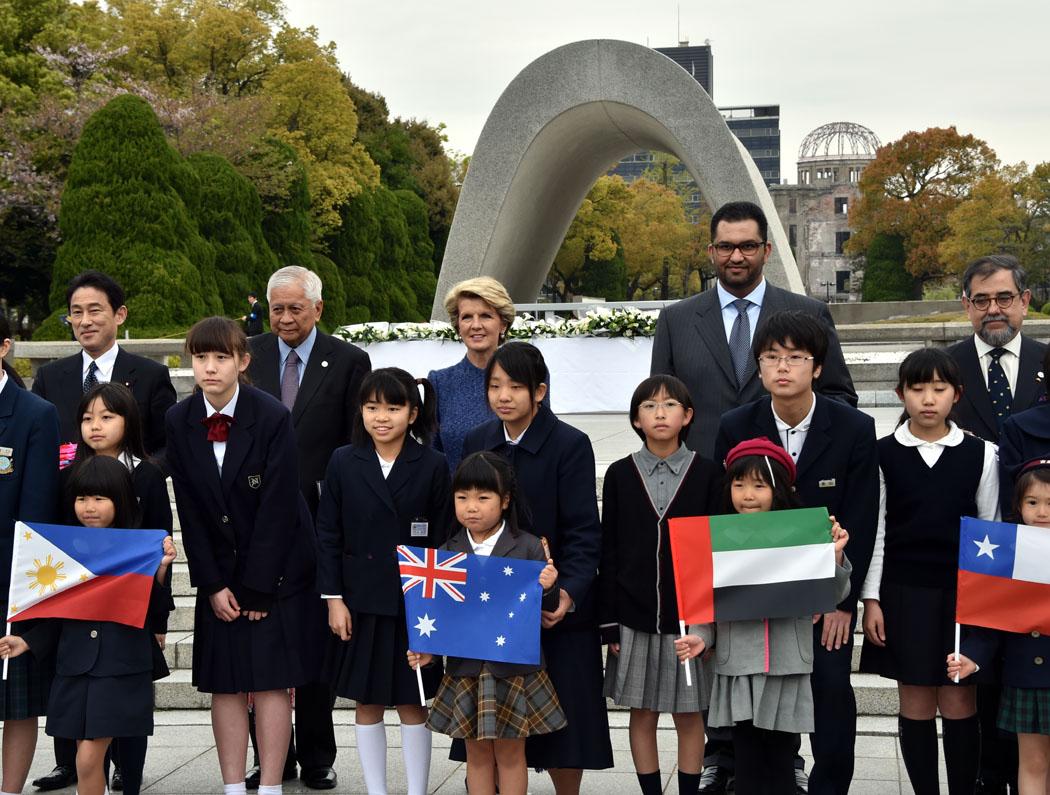 The Hon Julie Bishop MP, Minister for Foreign Affairs, with other NPDI Foreign Ministers and schoolchildren in front of the Cenotaph for the A-bomb victims in Hiroshima.