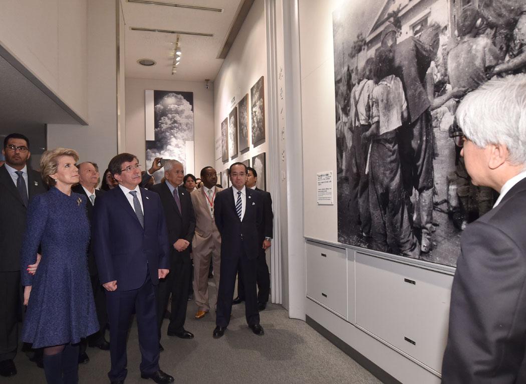 The Hon Julie Bishop, Minister for Foreign Affairs, listening to a presentation by the Director of the Hiroshima Peace Memorial Museum, Mr Shiga.