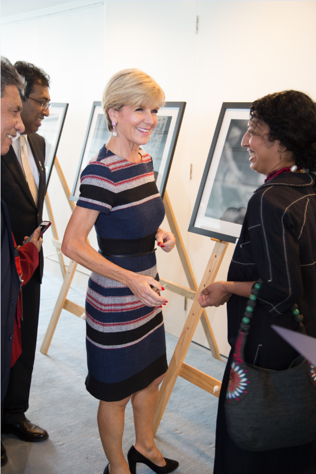 Foreign Minister Julie Bishop and Deputy Foreign, Dr Harsha de Silva, meet Melbourne Immigration Museum Director and photo exhibition participant Padmini Sebastian. Photo credit: DFAT/Linda Roche