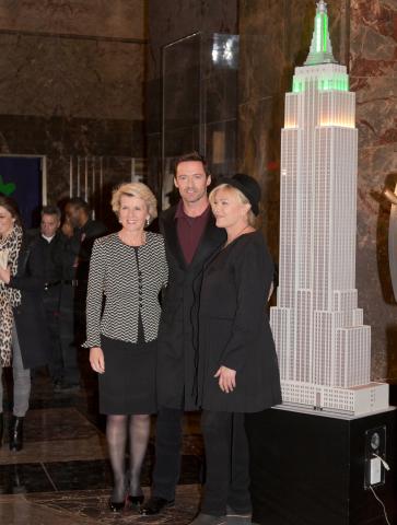 Foreign Minister Julie Bishop, Hugh Jackman and Deborra-lee Furness flip the switch to turn the Empire State Building green and gold for Australia Day. 24 January 2014.