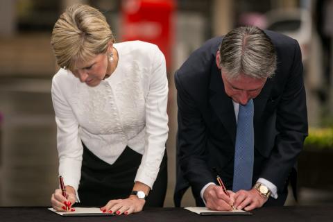 Foreign Minister Julie Bishop and Foreign Secretary Philip Hammond sign the Sydney Siege condolence book. 2 February 2015.