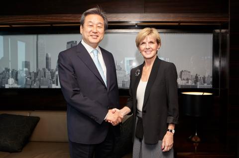 Foreign Minister Bishop greets Kim Moo-sung, Chairman of the Saenuri Party in Korea.