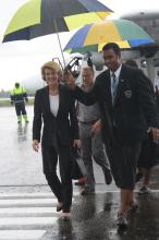 Arriving in Suva, Minister Bishop is escorted across the tarmac at Nausori Airport, accompanied by a Fiji Government official and Acting Australian High Commissioner Glenn Miles. Photo: DFAT. Friday, 14 February 2014.