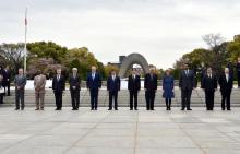 The Hon Julie Bishop MP, Minister for Foreign Affairs, standing with her NPDI Ministerial colleagues in front of the Cenotaph in Hiroshima.